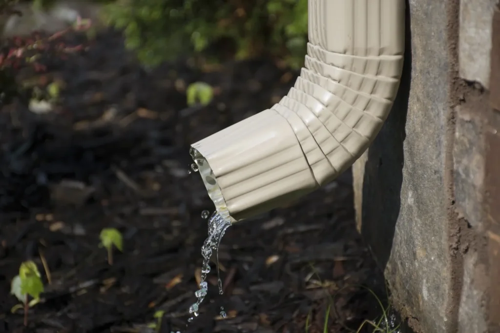 Downspout diverting water away from house