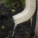 Downspout diverting water away from house